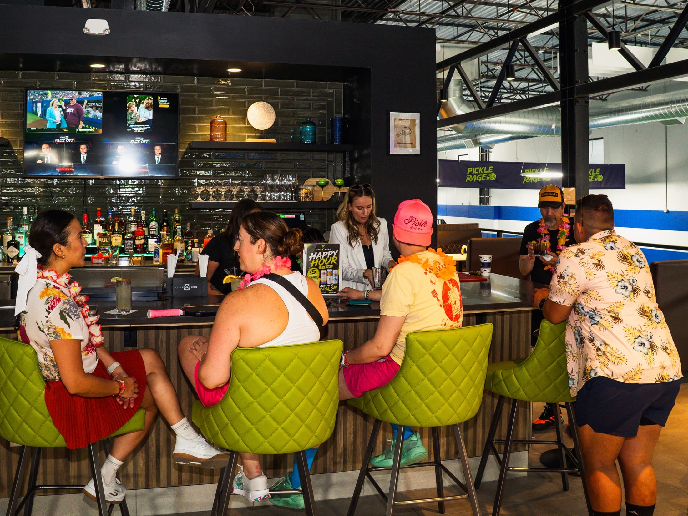 Guests seated at The Upper Court bar and lounge