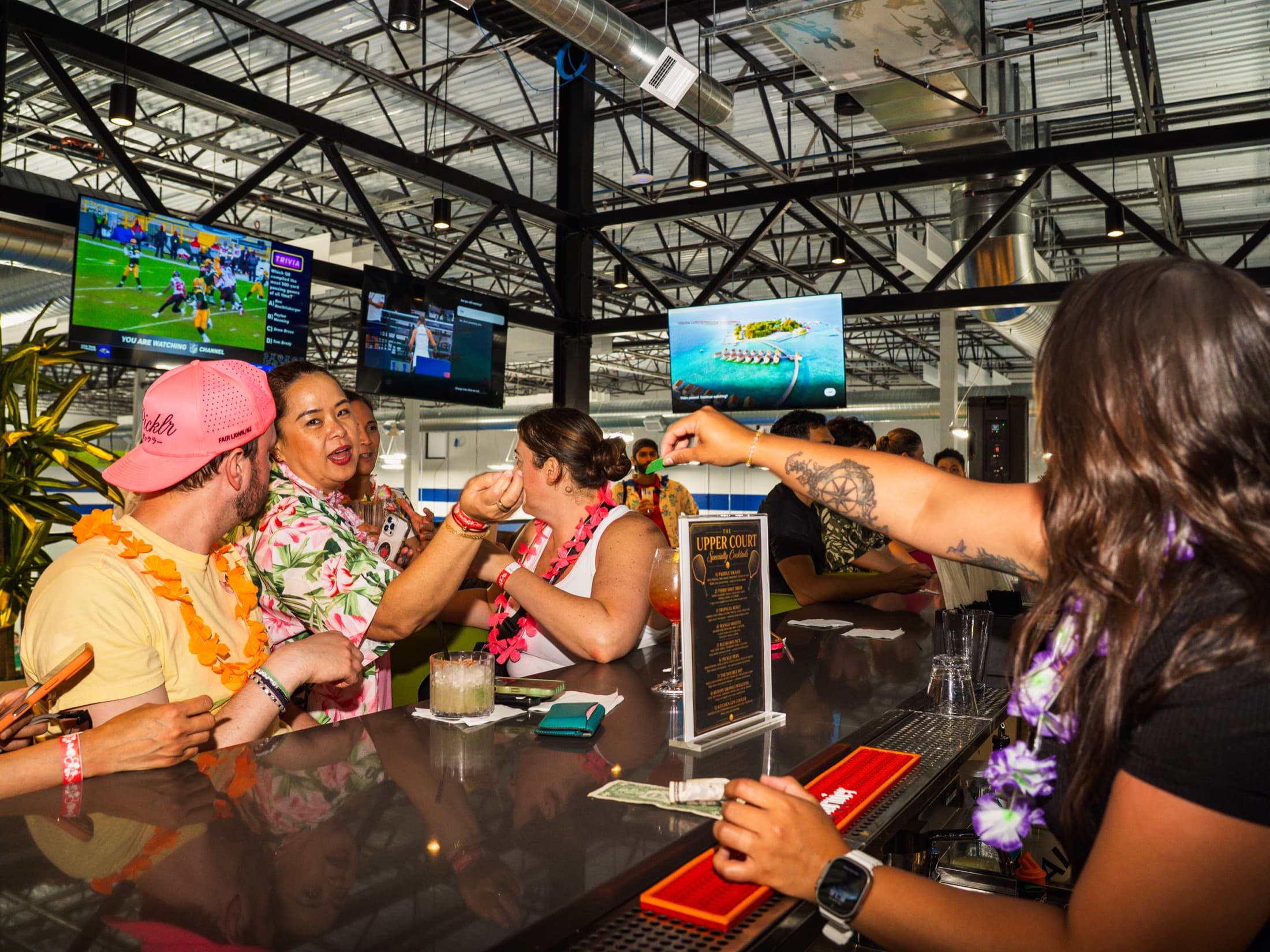 The Upper Court bar lounge and TV wall