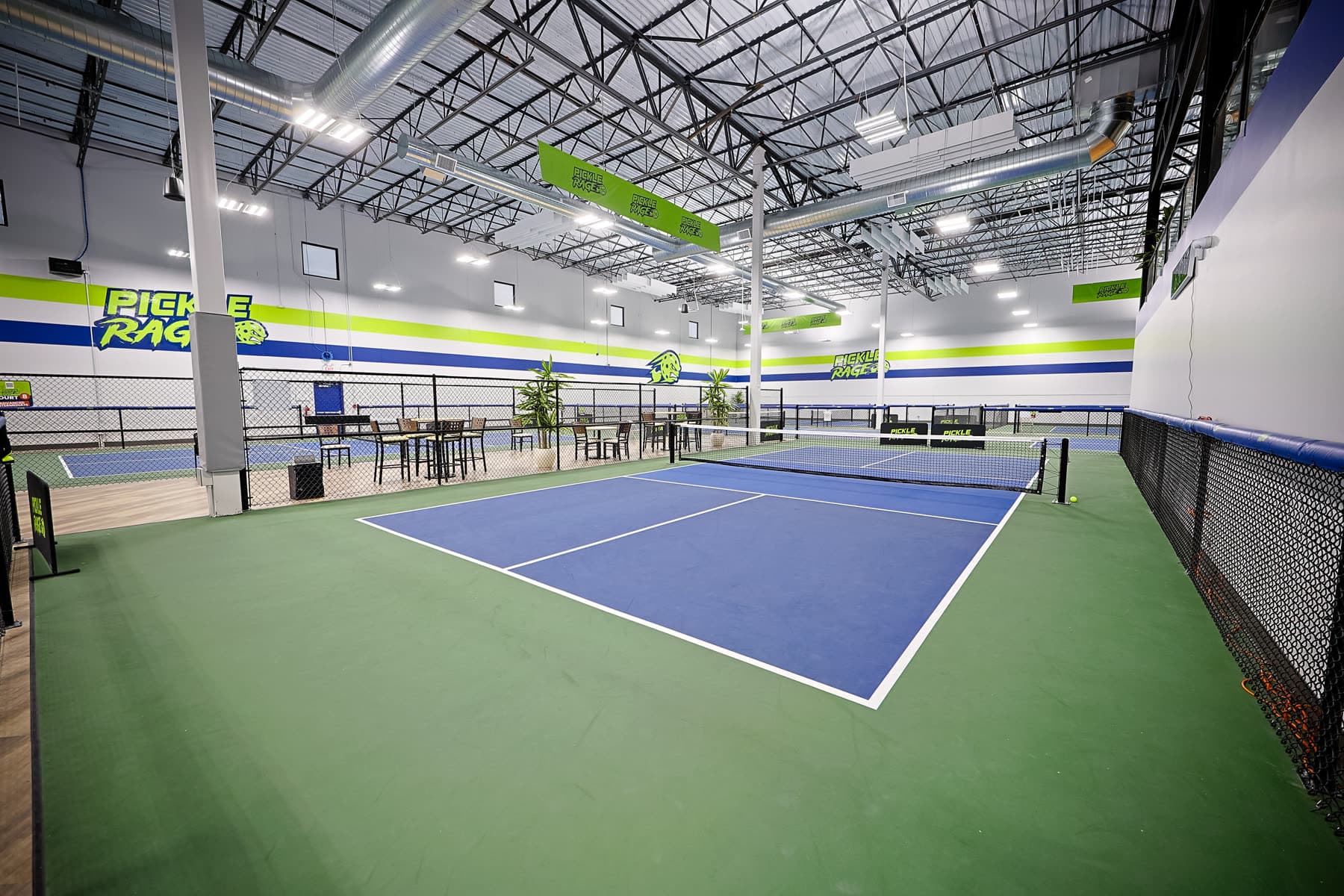 Court-side view of indoor pickleball at The Upper Court